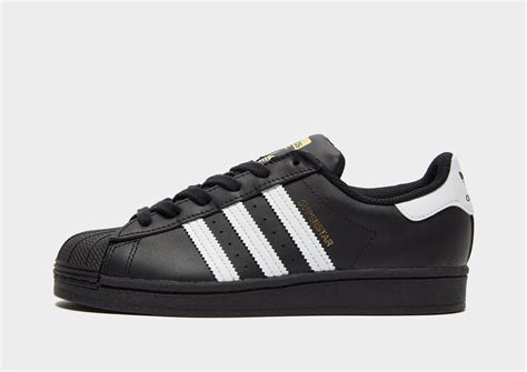 zwarte adidas superstar junior